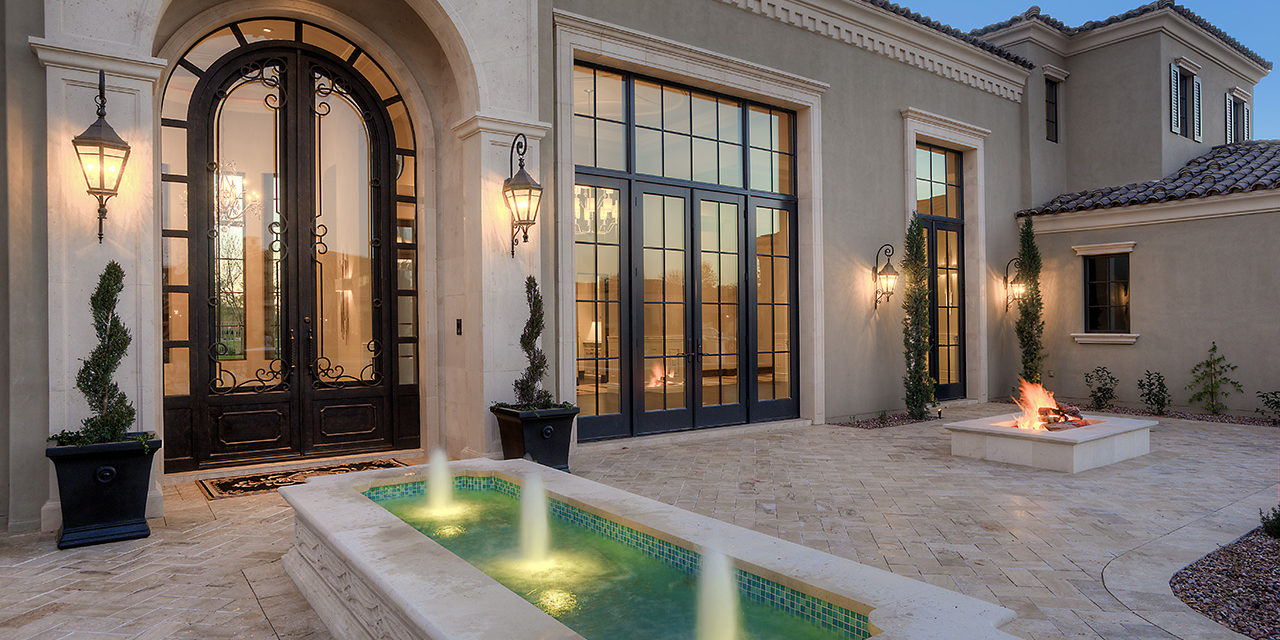 Formal Mediterranean Luxury Home front yard